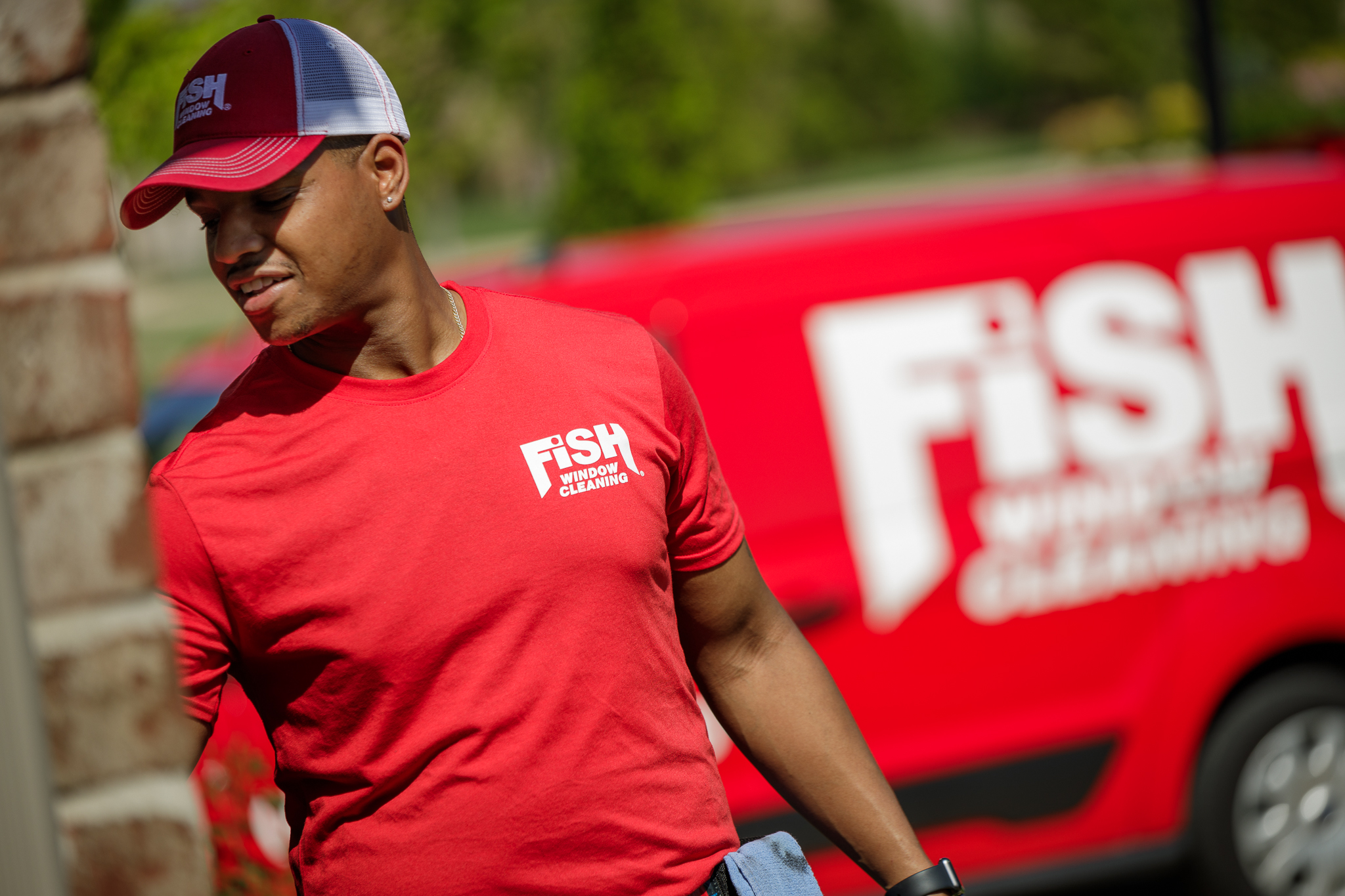 FISH Window Cleaner with Red Van in Background